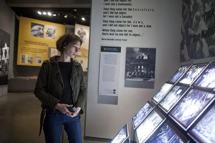 Visitors with audio headsets at the Hall of Names in Yad Vashem on a self-guided Jerusalem visit